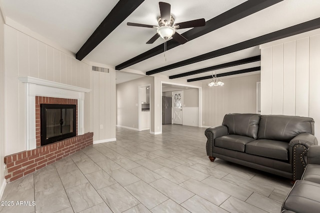6022 E Colby St, Mesa, AZ 85205 - living room with a ceiling fan, light marble finish flooring, a fireplace, a chandelier, and beamed ceiling