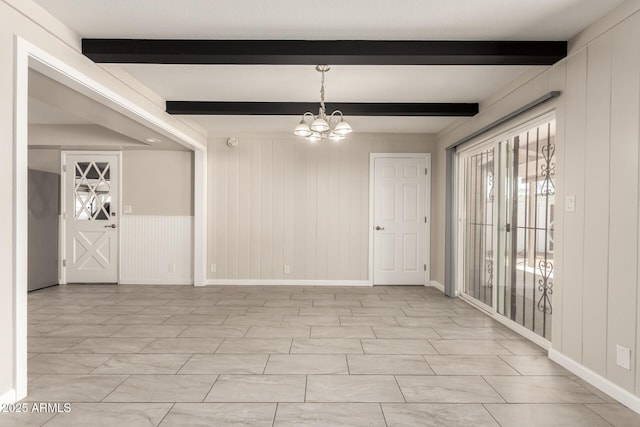 6022 E Colby St, Mesa, AZ 85205 - unfurnished room featuring a chandelier, beamed ceiling, and a decorative wall