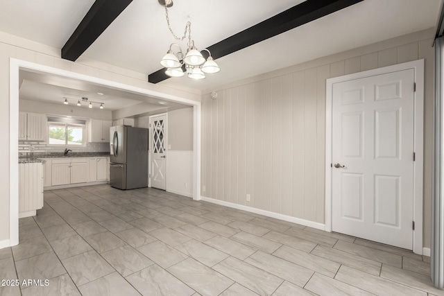 6022 E Colby St, Mesa, AZ 85205 - unfurnished living room with a chandelier and beamed ceiling