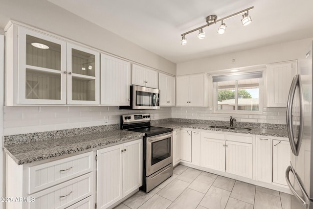 6022 E Colby St, Mesa, AZ 85205 - kitchen with stainless steel appliances, white cabinetry, and tasteful backsplash