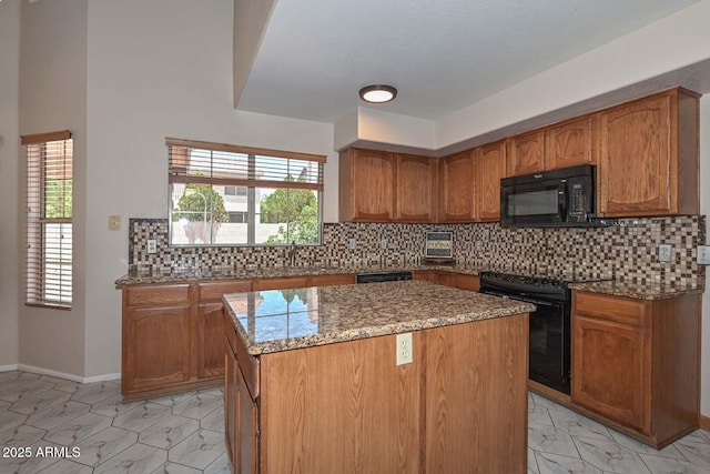 6928 W Oraibi Dr, Glendale, AZ 85308 - kitchen with black appliances, light marble finish floors, light stone countertops, brown cabinetry, and a center island