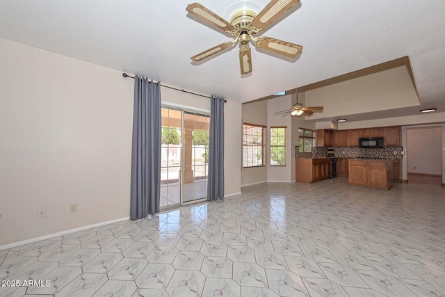 6928 W Oraibi Dr, Glendale, AZ 85308 - unfurnished living room with a ceiling fan and baseboards