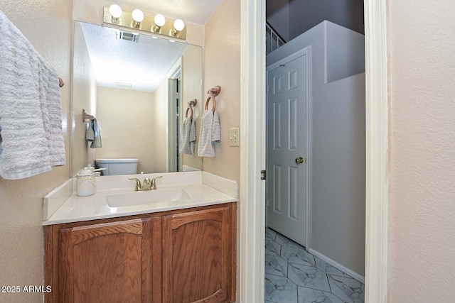 6928 W Oraibi Dr, Glendale, AZ 85308 - half bathroom with vanity and toilet