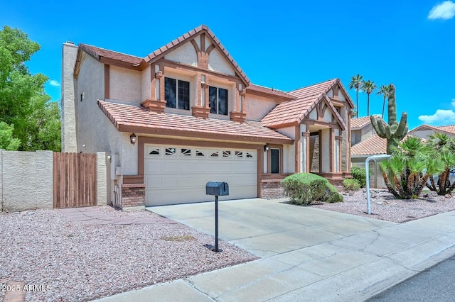 6928 W Oraibi Dr, Glendale, AZ 85308 - tudor-style house with a tiled roof, stucco siding, concrete driveway, and a garage