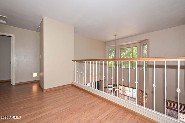 6928 W Oraibi Dr, Glendale, AZ 85308 - hallway with wood finished floors and baseboards