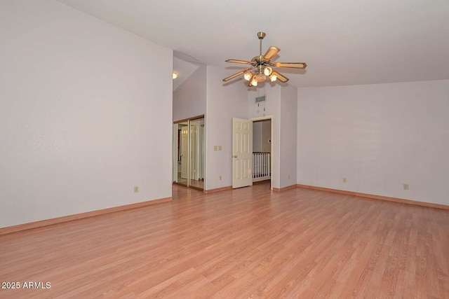 6928 W Oraibi Dr, Glendale, AZ 85308 - empty room with a ceiling fan, light wood-style floors, baseboards, high vaulted ceiling, and radiator