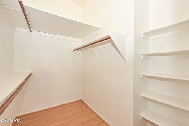 6928 W Oraibi Dr, Glendale, AZ 85308 - walk in closet with wood finished floors