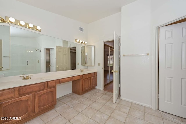 6928 W Oraibi Dr, Glendale, AZ 85308 - full bathroom with double vanity, a shower stall, and tile patterned flooring
