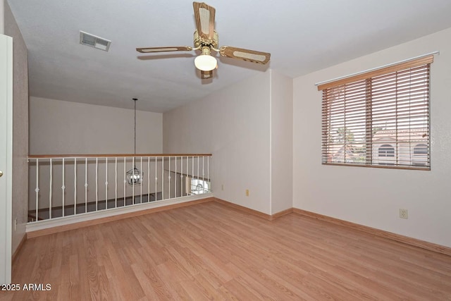 6928 W Oraibi Dr, Glendale, AZ 85308 - unfurnished room featuring wood finished floors, ceiling fan, and baseboards