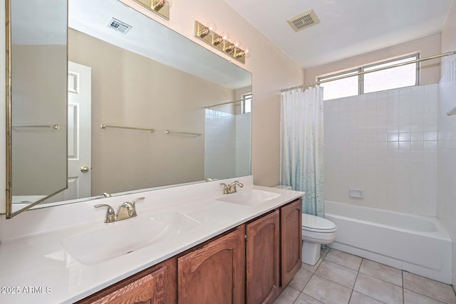 6928 W Oraibi Dr, Glendale, AZ 85308 - full bathroom with toilet, shower / bath combo with shower curtain, double vanity, and tile patterned flooring