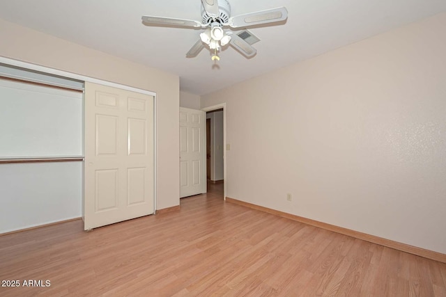 6928 W Oraibi Dr, Glendale, AZ 85308 - unfurnished bedroom with light wood-type flooring, baseboards, a closet, and ceiling fan