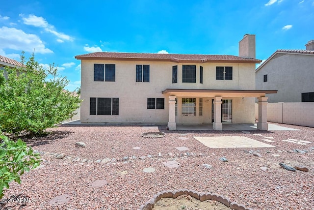 6928 W Oraibi Dr, Glendale, AZ 85308 - rear view of property featuring a patio area, a chimney, and stucco siding