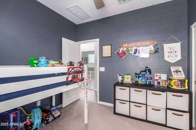 bedroom with visible vents, light colored carpet, and a ceiling fan