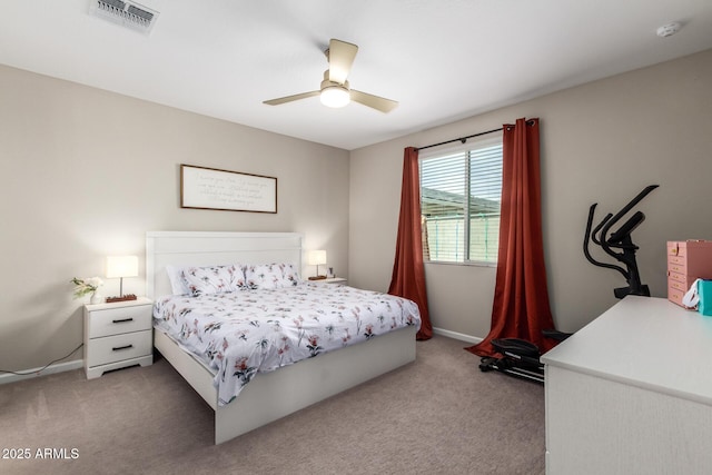 carpeted bedroom with visible vents, baseboards, and ceiling fan