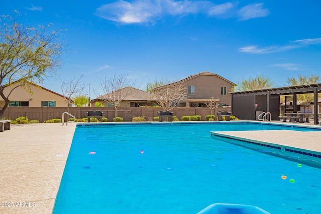 pool featuring a patio, fence, and a pergola