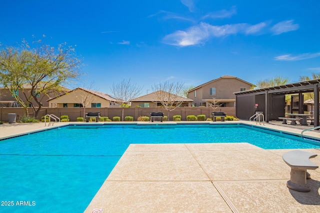 community pool featuring a patio, fence, and a pergola