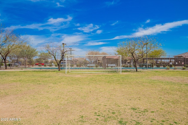 view of community with fence