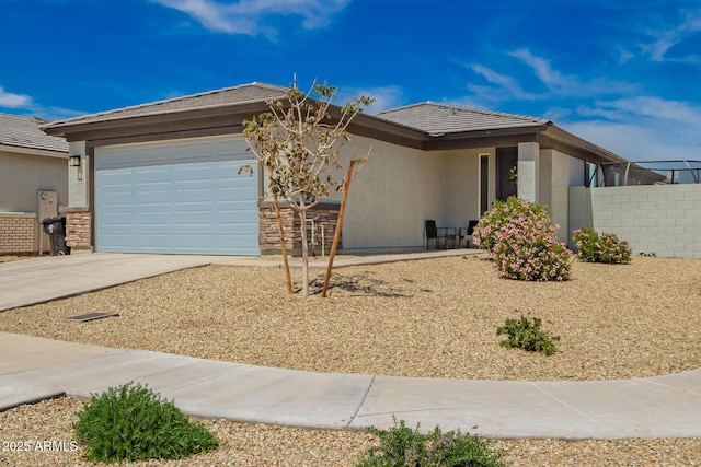 single story home featuring stucco siding, an attached garage, driveway, and a tile roof