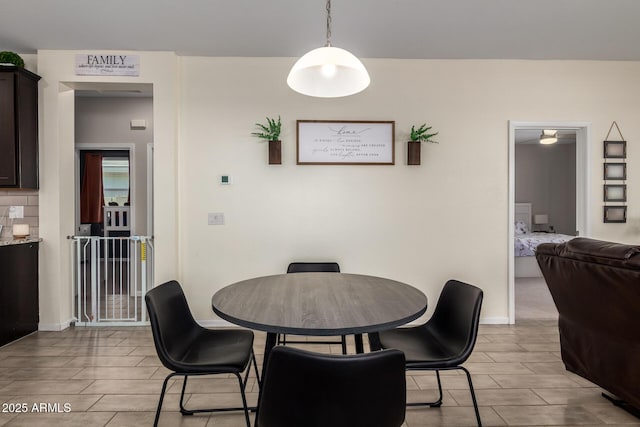 dining area featuring baseboards