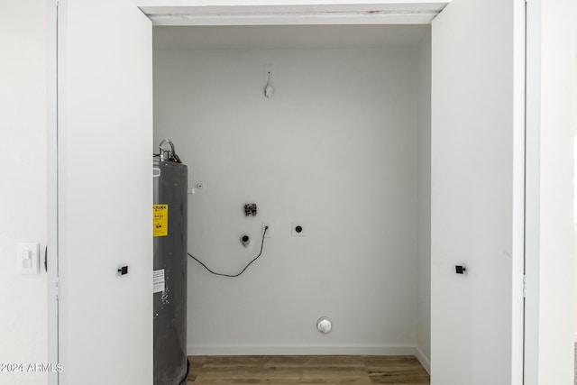 laundry room featuring electric water heater, hookup for an electric dryer, wood-type flooring, and washer hookup