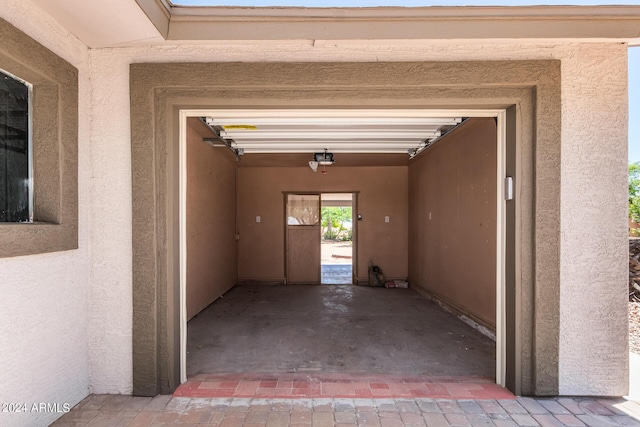 garage featuring a garage door opener