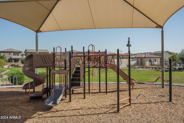 view of jungle gym featuring a yard