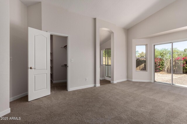 4526 E Bannock St, Phoenix, AZ 85044 - carpeted spare room featuring baseboards and high vaulted ceiling