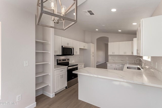 4526 E Bannock St, Phoenix, AZ 85044 - kitchen featuring appliances with stainless steel finishes, a sink, open shelves, lofted ceiling, and arched walkways