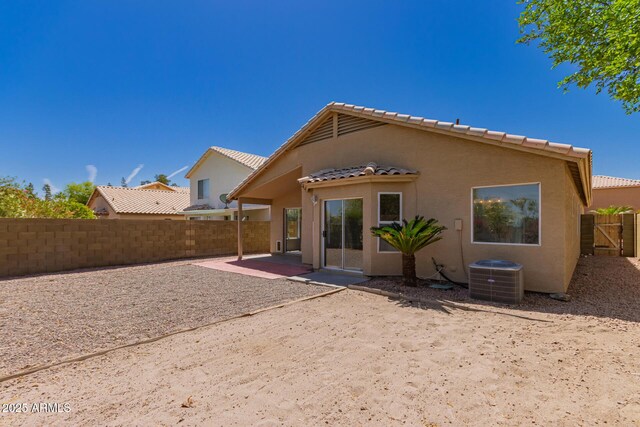 4526 E Bannock St, Phoenix, AZ 85044 - rear view of property with central AC unit, a patio area, a fenced backyard, stucco siding, and a tile roof