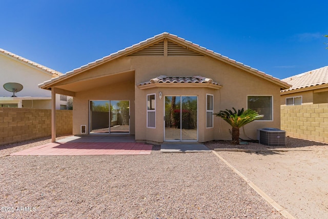 4526 E Bannock St, Phoenix, AZ 85044 - back of property with a tile roof, fence, stucco siding, central AC, and a patio