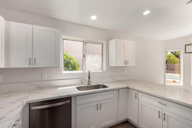 4526 E Bannock St, Phoenix, AZ 85044 - kitchen featuring stainless steel dishwasher, white cabinets, a sink, recessed lighting, and light stone countertops