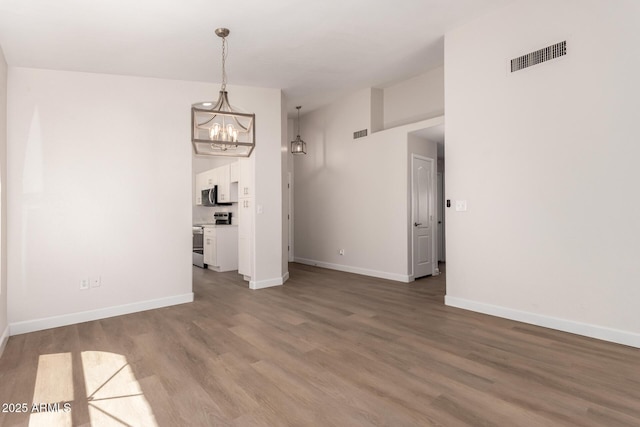 4526 E Bannock St, Phoenix, AZ 85044 - unfurnished dining area with a chandelier, baseboards, and wood finished floors