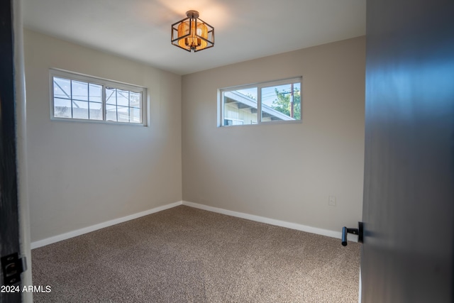 empty room featuring carpet and plenty of natural light