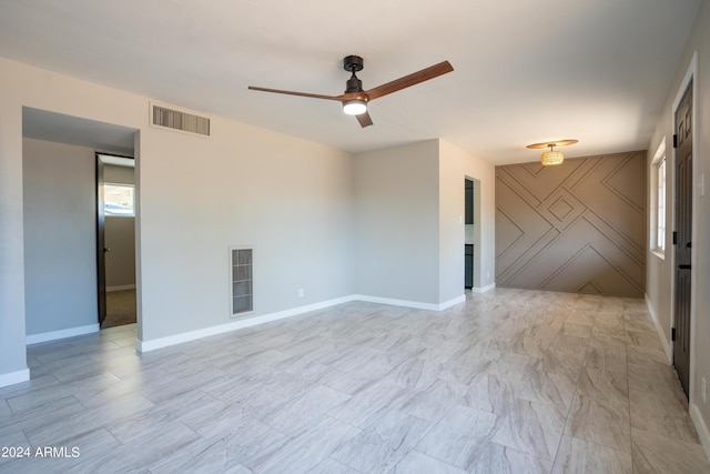 unfurnished room with ceiling fan