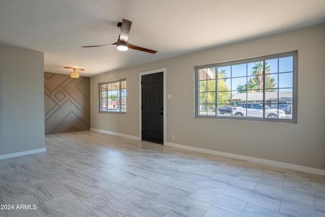 spare room featuring ceiling fan