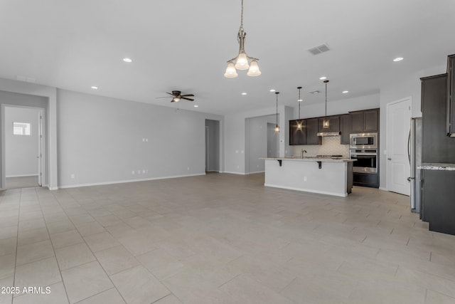 22788 E Orion Way, Queen Creek, AZ 85142 - unfurnished living room featuring a ceiling fan and recessed lighting