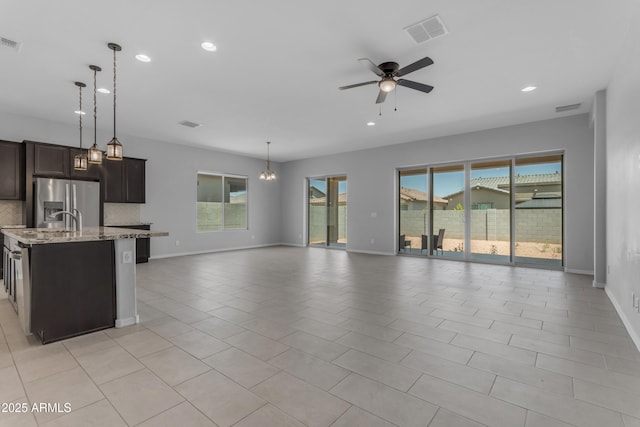22788 E Orion Way, Queen Creek, AZ 85142 - kitchen with open floor plan, stainless steel fridge with ice dispenser, plenty of natural light, and recessed lighting