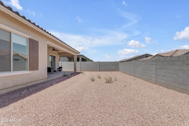 22788 E Orion Way, Queen Creek, AZ 85142 - fenced backyard with a ceiling fan and a patio area