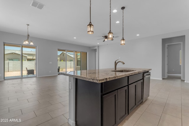 22788 E Orion Way, Queen Creek, AZ 85142 - kitchen featuring open floor plan, light stone counters, recessed lighting, a ceiling fan, and an island with sink