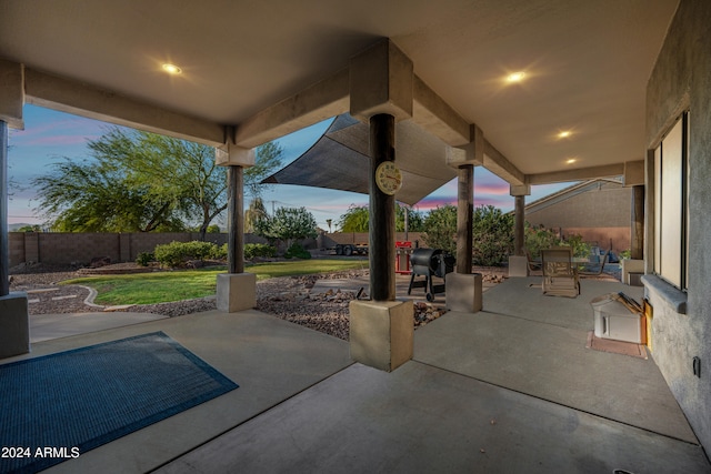 patio terrace at dusk with a yard