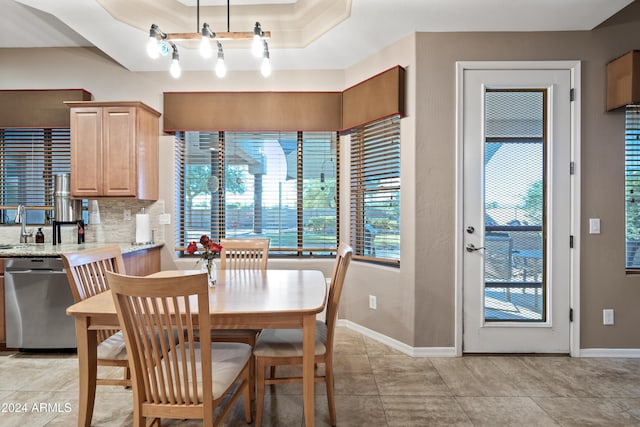 dining space featuring light tile patterned flooring