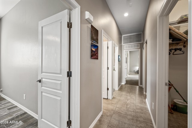 corridor with light tile patterned flooring