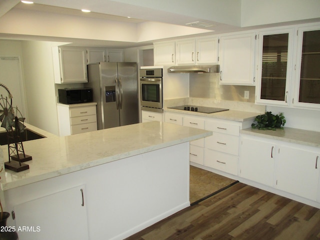 kitchen featuring light stone counters, black appliances, dark hardwood / wood-style floors, kitchen peninsula, and white cabinets