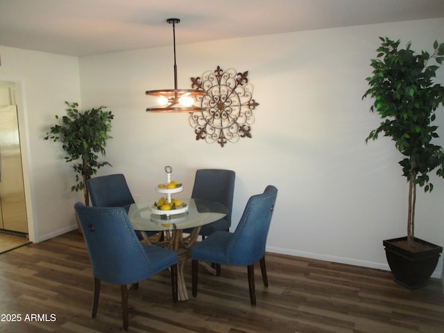 dining area with dark hardwood / wood-style floors