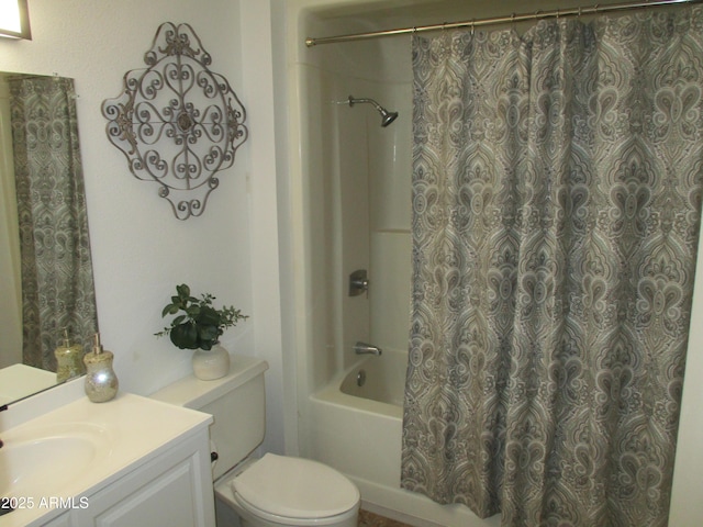 full bathroom with vanity, shower / bath combo, and toilet