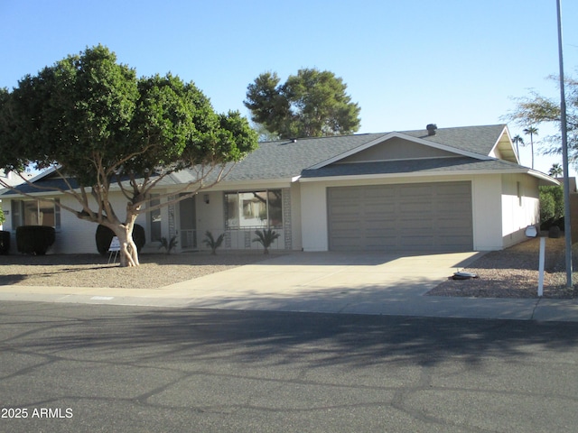 ranch-style house featuring a garage