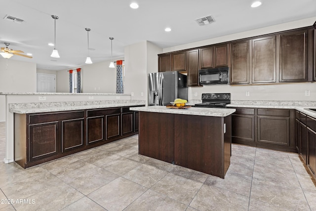 kitchen featuring hanging light fixtures, dark brown cabinets, black appliances, and a kitchen island