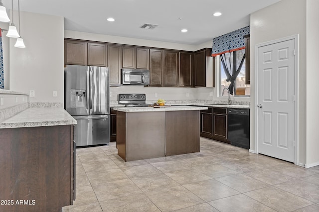 kitchen featuring light tile patterned flooring, dark brown cabinetry, sink, hanging light fixtures, and black appliances