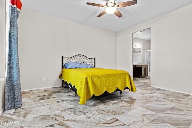 bedroom with ensuite bath and ceiling fan