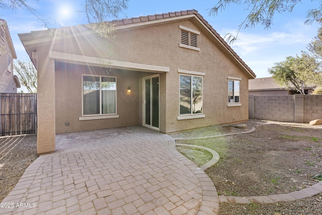 rear view of property with a patio area